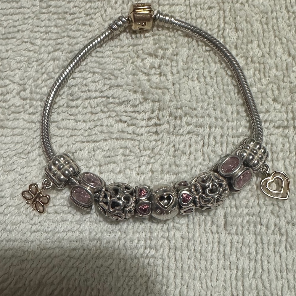 Pandora Bracelet. Excellent condition. 2 gold charms